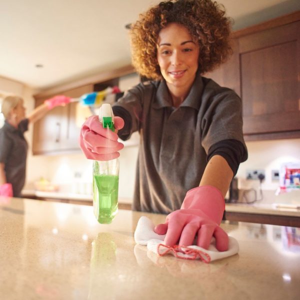 People cleaning a kitchen