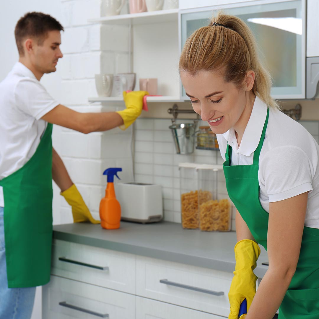 Cleaning crew cleaning kitchen