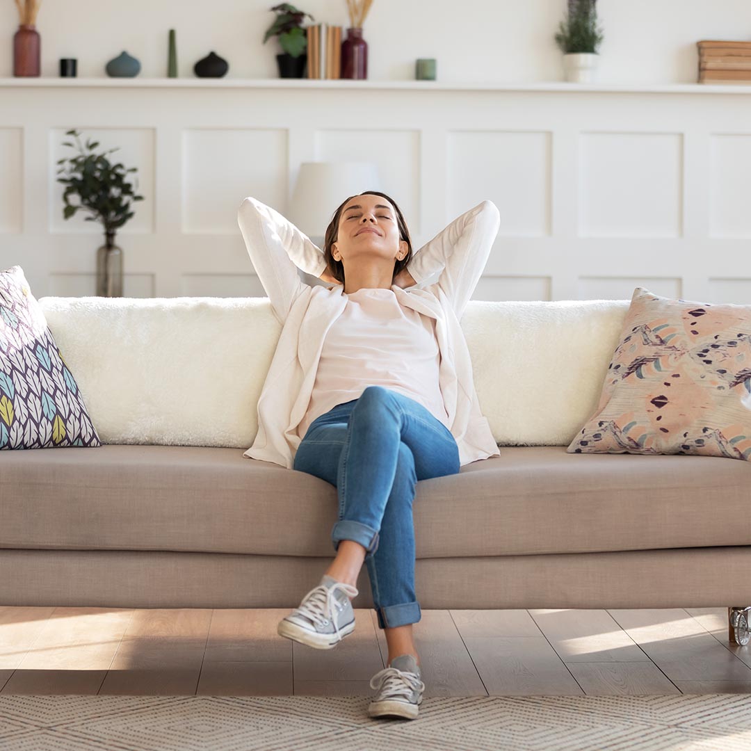 Relaxed woman sitting on a sofa