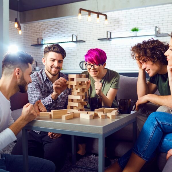 friends playing jenga at home