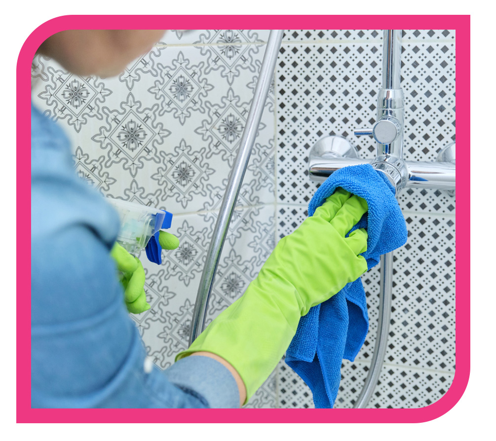 person scrubbing shower